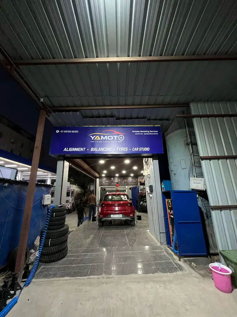 Yamoto workshop driveway with tyre racks, Narsingi